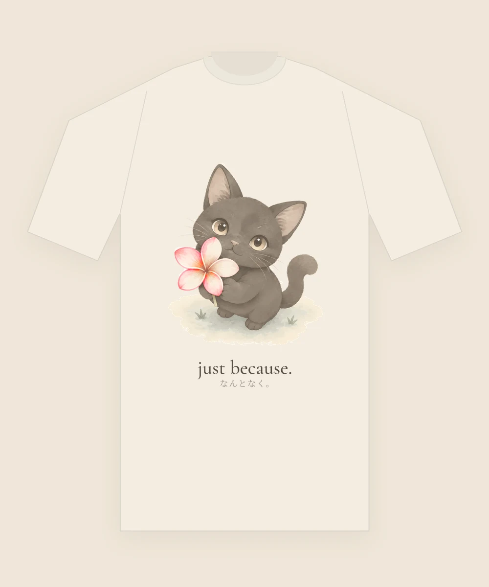 the black kitten printed on the chest of a cream t-shirt